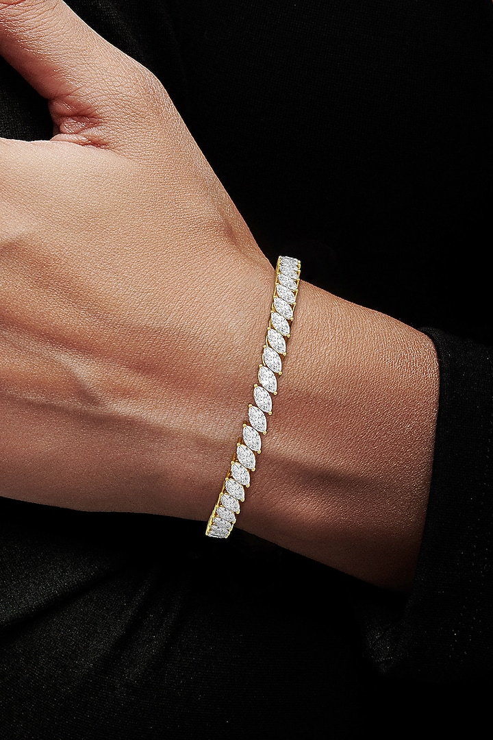 Gold Finish Marquise-Shaped Cubic Zirconia Crystal Tennis Bracelet In Sterling Silver by MISS JO at Pernia's Pop Up Shop