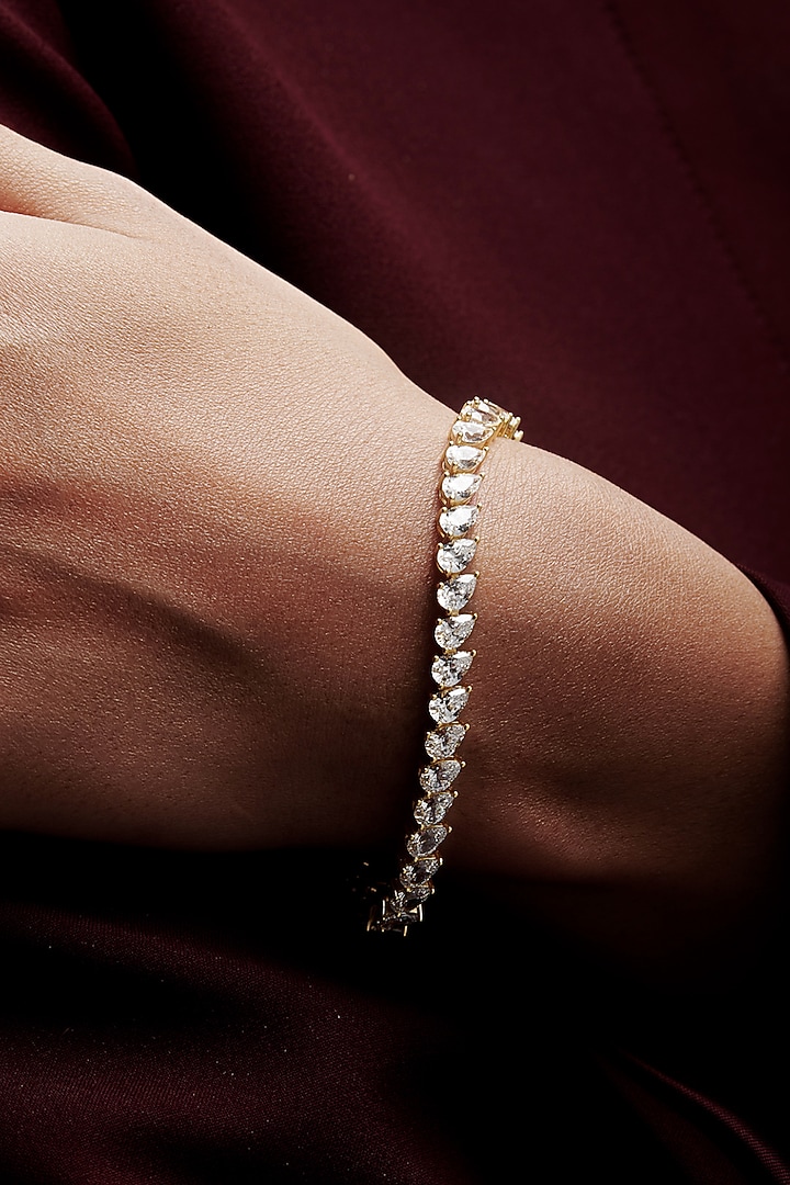Gold Finish Pear-Shaped Cubic Zirconia Crystal Tennis Bracelet In Sterling Silver by MISS JO at Pernia's Pop Up Shop