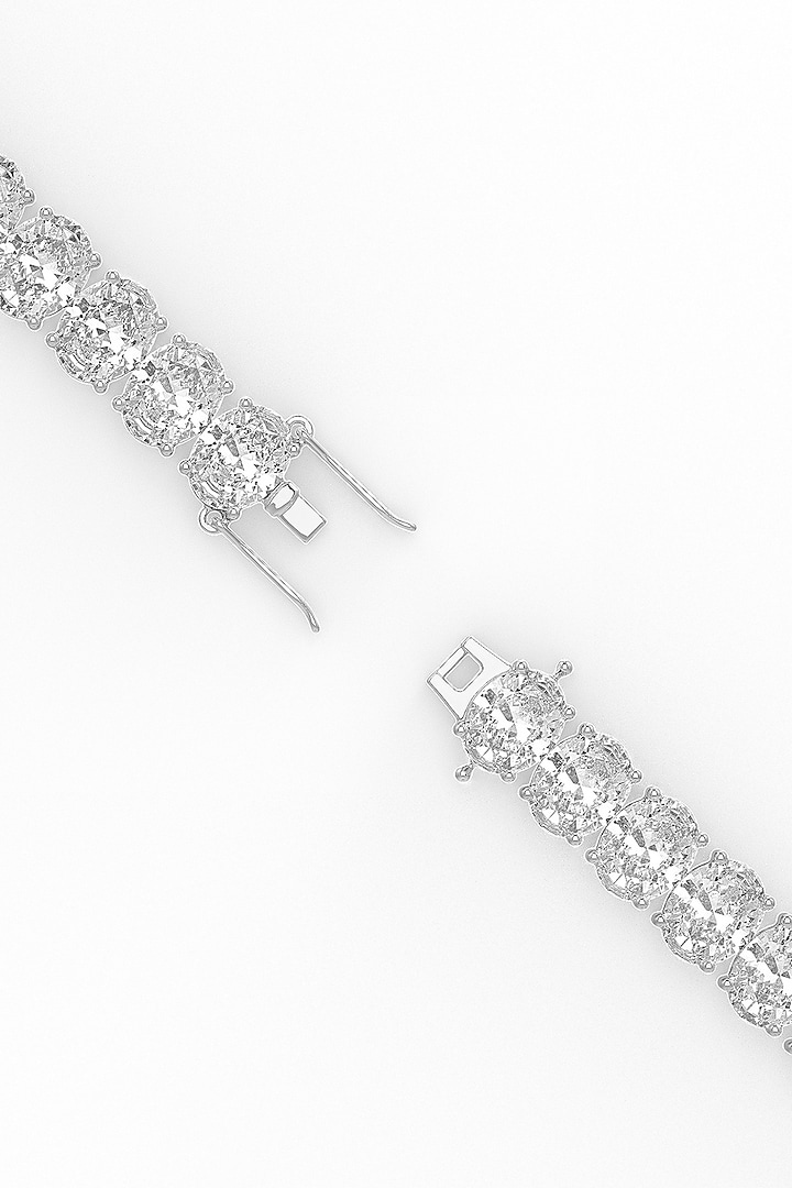 White Rhodium Finish Oval-Shaped Cubic Zirconia Crystal Tennis Bracelet In Sterling Silver by MISS JO at Pernia's Pop Up Shop
