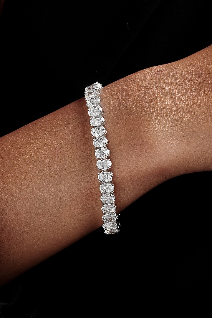 White Rhodium Finish Oval-Shaped Cubic Zirconia Crystal Tennis Bracelet In Sterling Silver by MISS JO at Pernia's Pop Up Shop