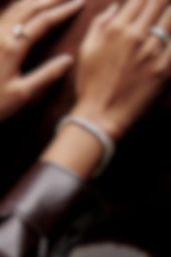 Gold Finish Emerald-Cut Cubic Zirconia Crystal Tennis Bracelet In Sterling Silver by MISS JO at Pernia's Pop Up Shop