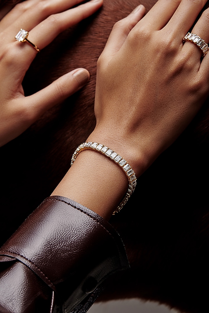 Gold Finish Emerald-Cut Cubic Zirconia Crystal Tennis Bracelet In Sterling Silver by MISS JO at Pernia's Pop Up Shop