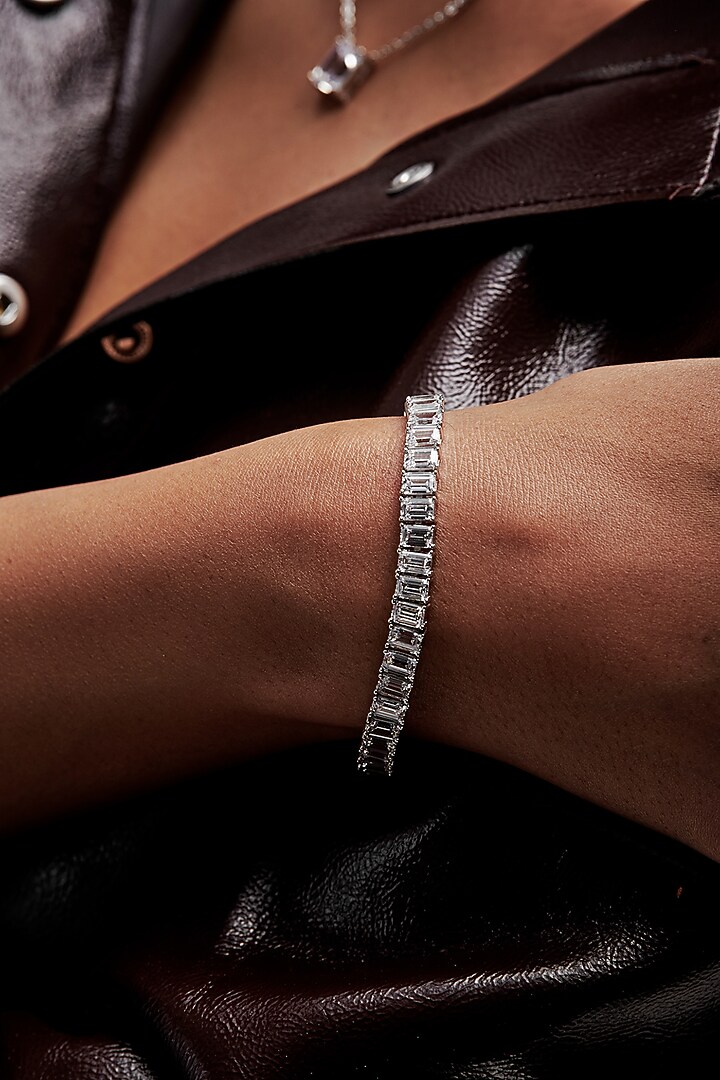 White Rhodium Finish Emerald-Cut Cubic Zirconia Crystal Tennis Bracelet In Sterling Silver by MISS JO at Pernia's Pop Up Shop