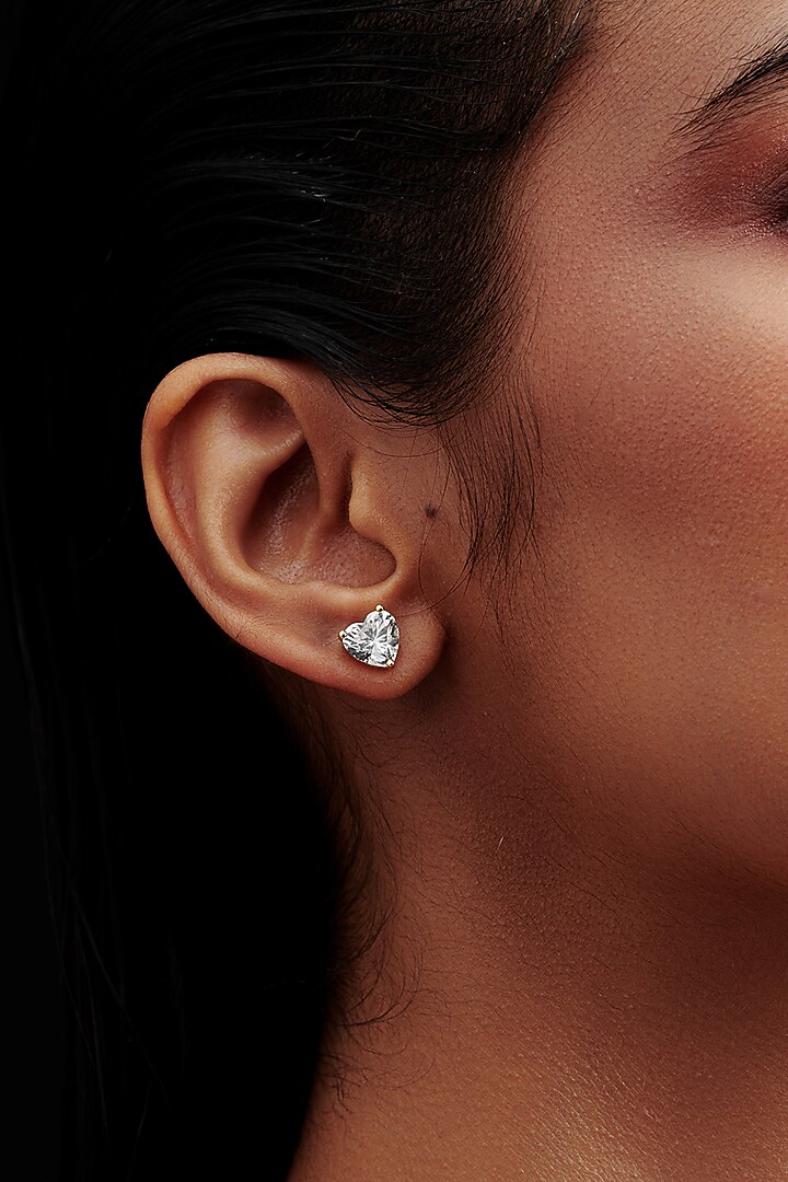 Gold Finish Heart-Shaped Cubic Zirconia Crystal Stud Earrings In Sterling Silver by MISS JO at Pernia's Pop Up Shop