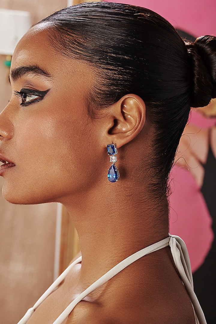 White Rhodium Finish Sapphire Teardrop Cubic Zirconia Crystal Dangler Earrings In Sterling Silver by MISS JO at Pernia's Pop Up Shop