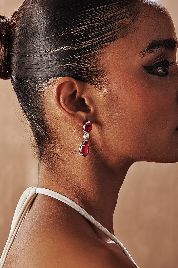White Rhodium Finish Ruby Teardrop Cubic Zirconia Crystal Dangler Earrings In Sterling Silver by MISS JO at Pernia's Pop Up Shop