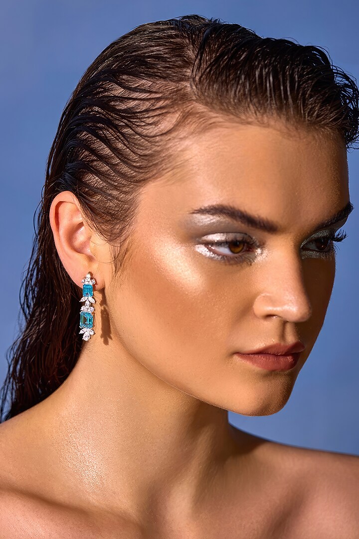 White Rhodium Finish Aqua Cubic Zirconia Crystal Floral Stud Earrings In Sterling Silver by MISS JO at Pernia's Pop Up Shop
