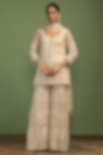 Off-White Net Sequin Embroidered Party Wear Sharara Set by Mustard Moon by Neyha and Vrinda at Pernia's Pop Up Shop