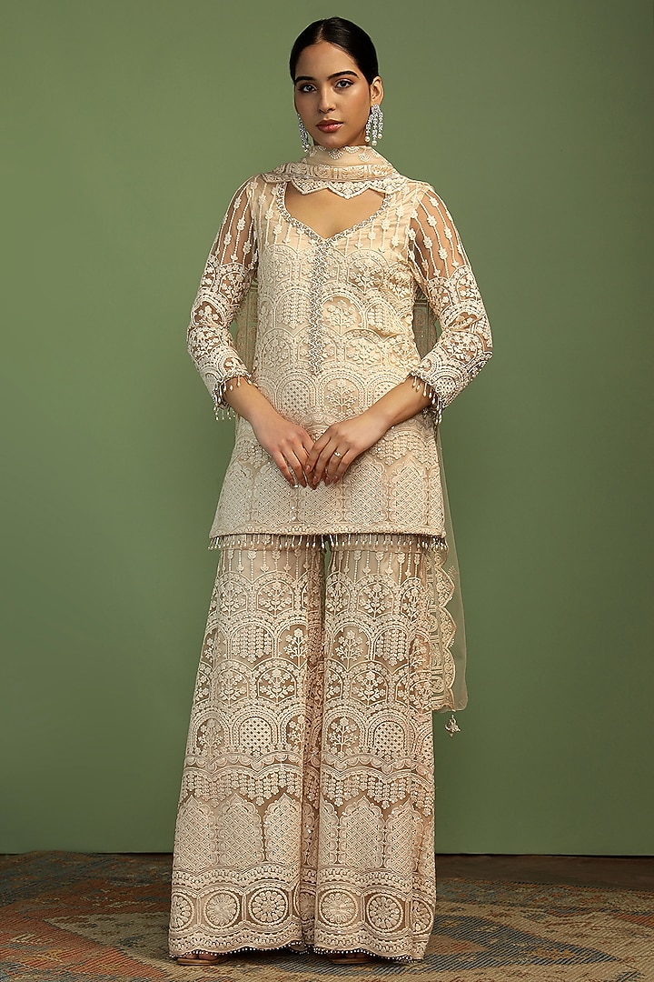 Off-White Net Sequin Embroidered Party Wear Sharara Set by Mustard Moon by Neyha and Vrinda at Pernia's Pop Up Shop