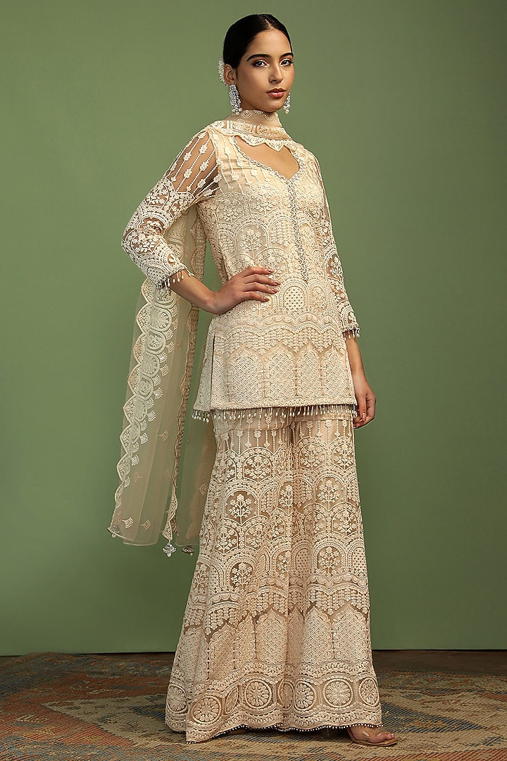 Off-White Net Sequin Embroidered Party Wear Sharara Set by Mustard Moon by Neyha and Vrinda at Pernia's Pop Up Shop