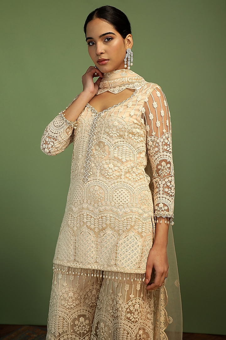 Off-White Net Sequin Embroidered Party Wear Sharara Set by Mustard Moon by Neyha and Vrinda at Pernia's Pop Up Shop