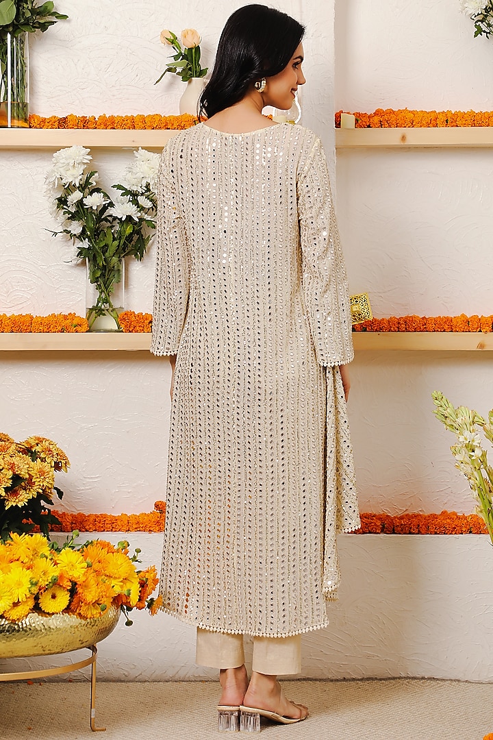 Ivory Embroidered Asymmetrical Kurta Set by Mustard Moon by Neyha and Vrinda at Pernia's Pop Up Shop