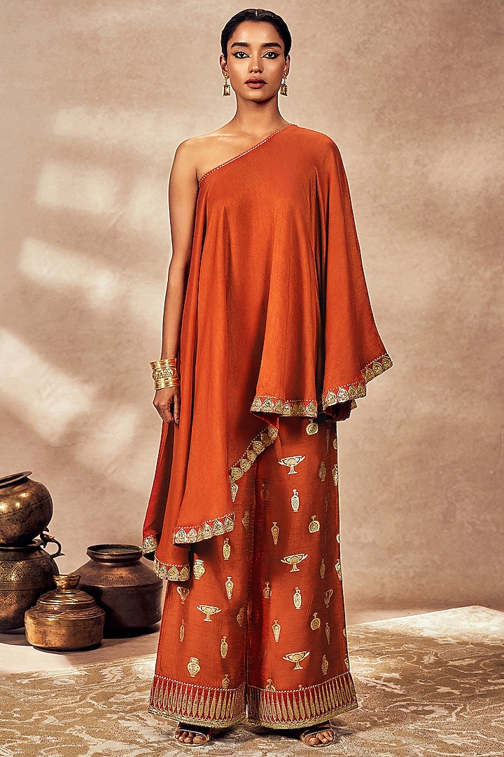 Rust Raw Silk Kinari Gota Embroidered One-Shoulder Asymmetrical Tunic Set by Masaba at Pernia's Pop Up Shop