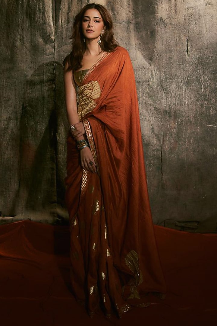 Rust Raw Silk Foil Printed & Embellished Wedding Saree Set by Masaba at Pernia's Pop Up Shop