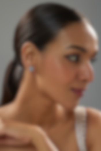 White Finish Halo Diamond & Aquamarine Gemstone Pear-Shaped Stud Earrings In Sterling Silver by Mon Tresor at Pernia's Pop Up Shop