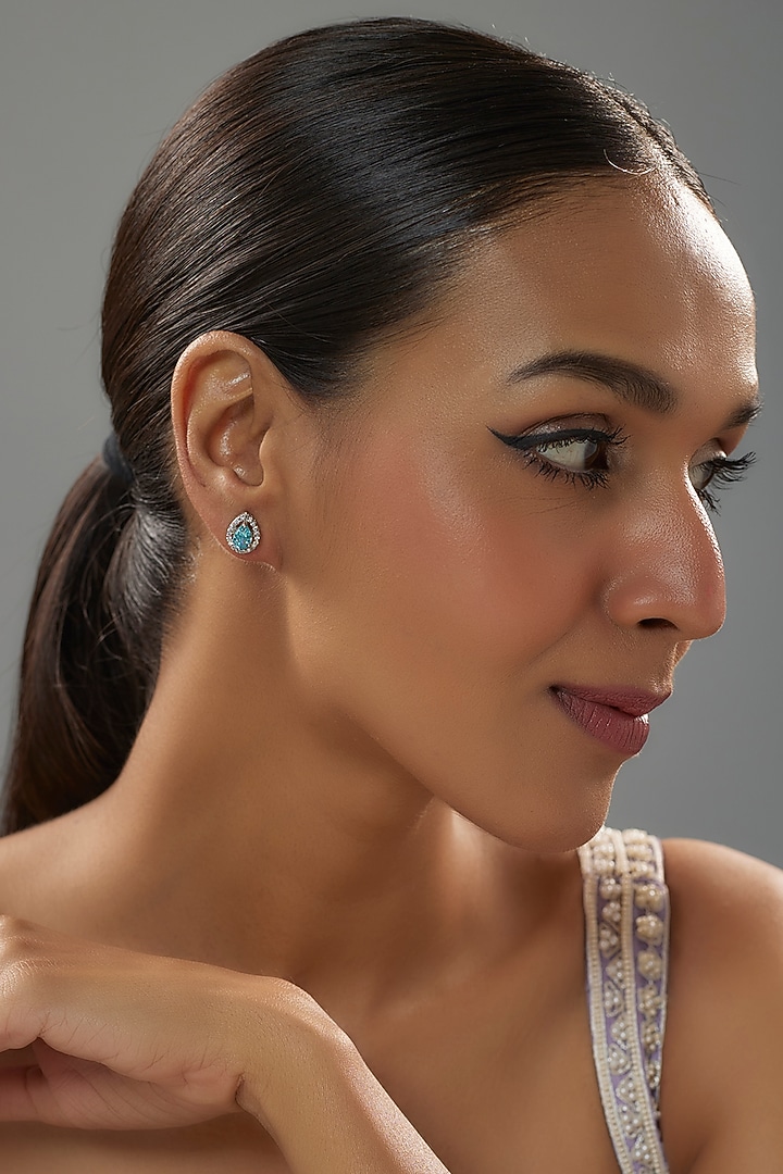 White Finish Halo Diamond & Aquamarine Gemstone Pear-Shaped Stud Earrings In Sterling Silver by Mon Tresor at Pernia's Pop Up Shop