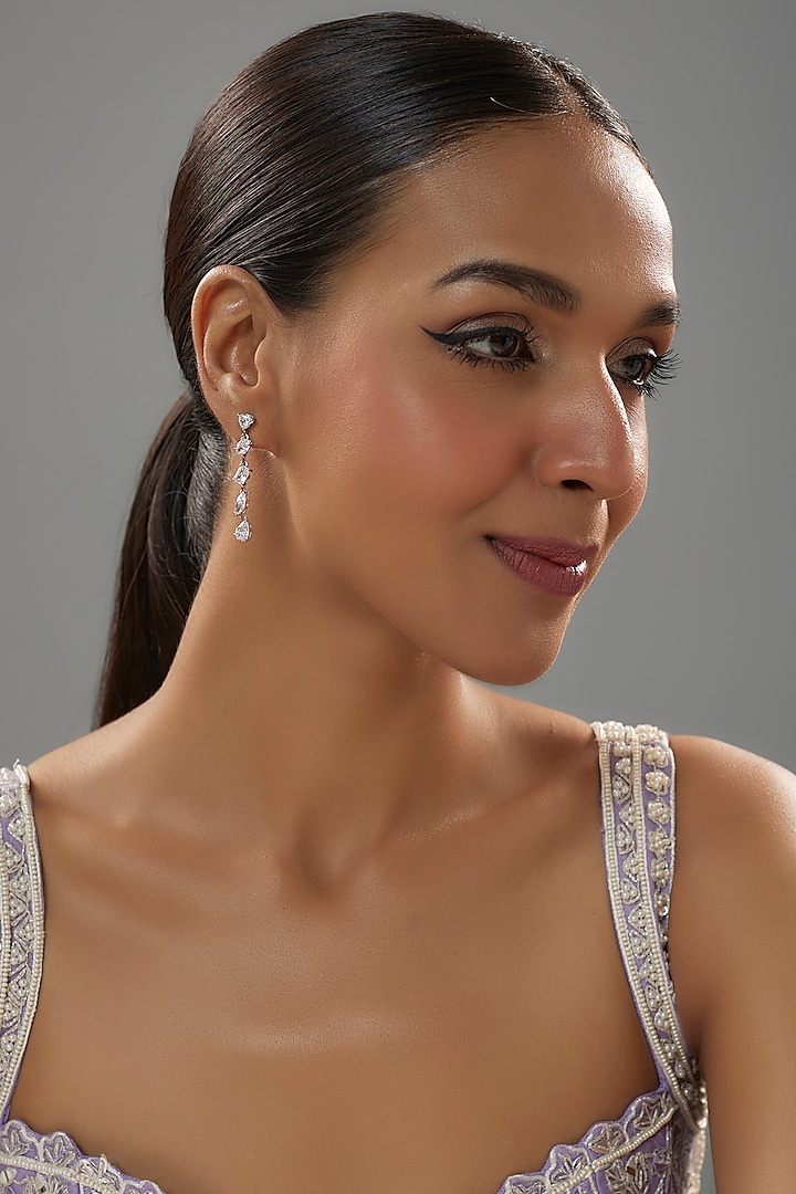 White Finish Zircon Dangler Earrings In Sterling Silver by Mon Tresor at Pernia's Pop Up Shop