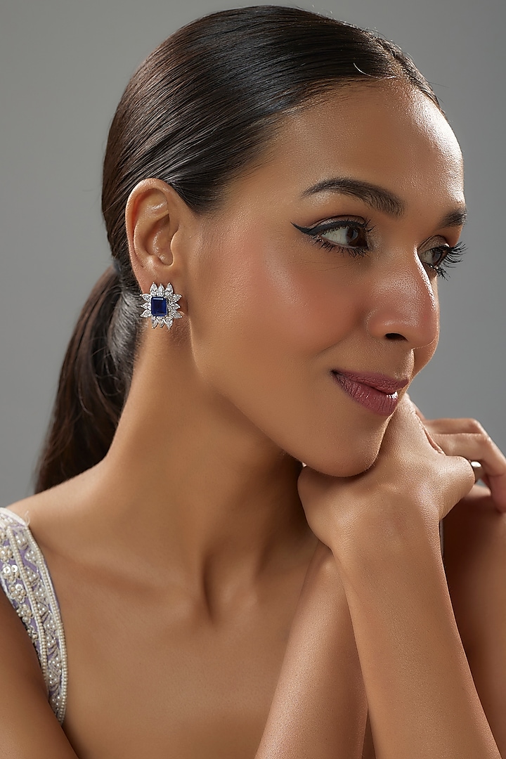 White Finish Halo Diamond & Blue Sapphire Stone Stud Earrings In Sterling Silver by Mon Tresor at Pernia's Pop Up Shop