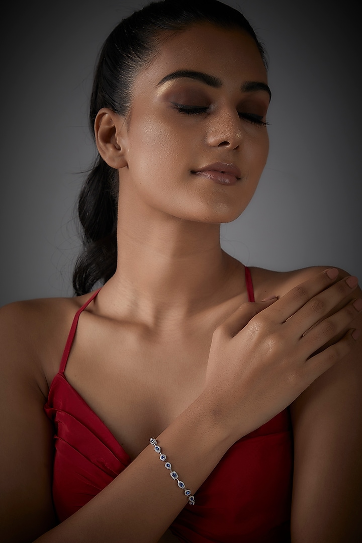 White Finish Blue Stone & Diamond Tennis Bracelet In Sterling Silver by Mon Tresor at Pernia's Pop Up Shop