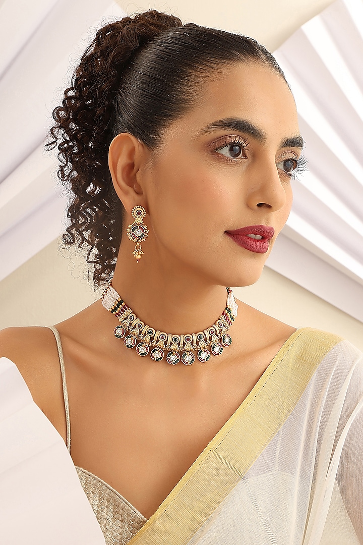 Gold Finish Handcrafted Red & Green Stone Temple Choker Necklace Set by MUDRA LUXE at Pernia's Pop Up Shop