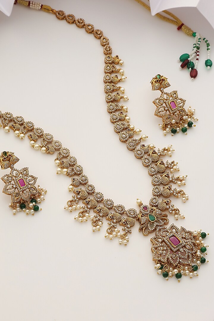 Gold Finish Handcrafted Red & Green Stone Temple Long Necklace Set by MUDRA LUXE at Pernia's Pop Up Shop