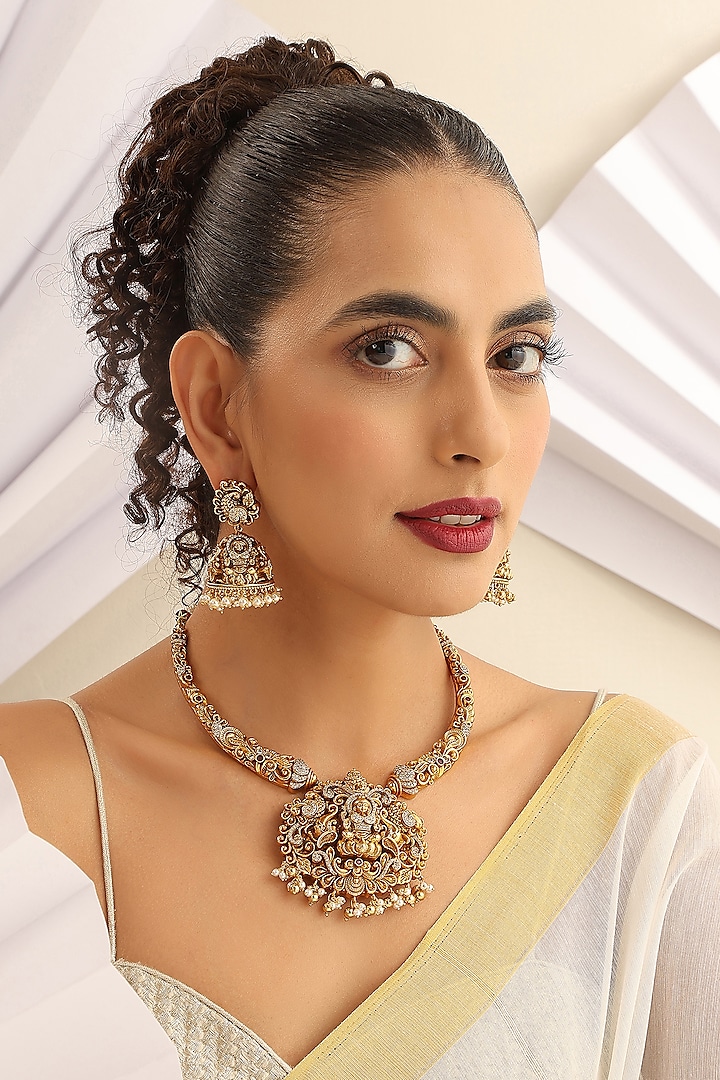 Gold Finish Handcrafted Temple Hasli Necklace Set by MUDRA LUXE