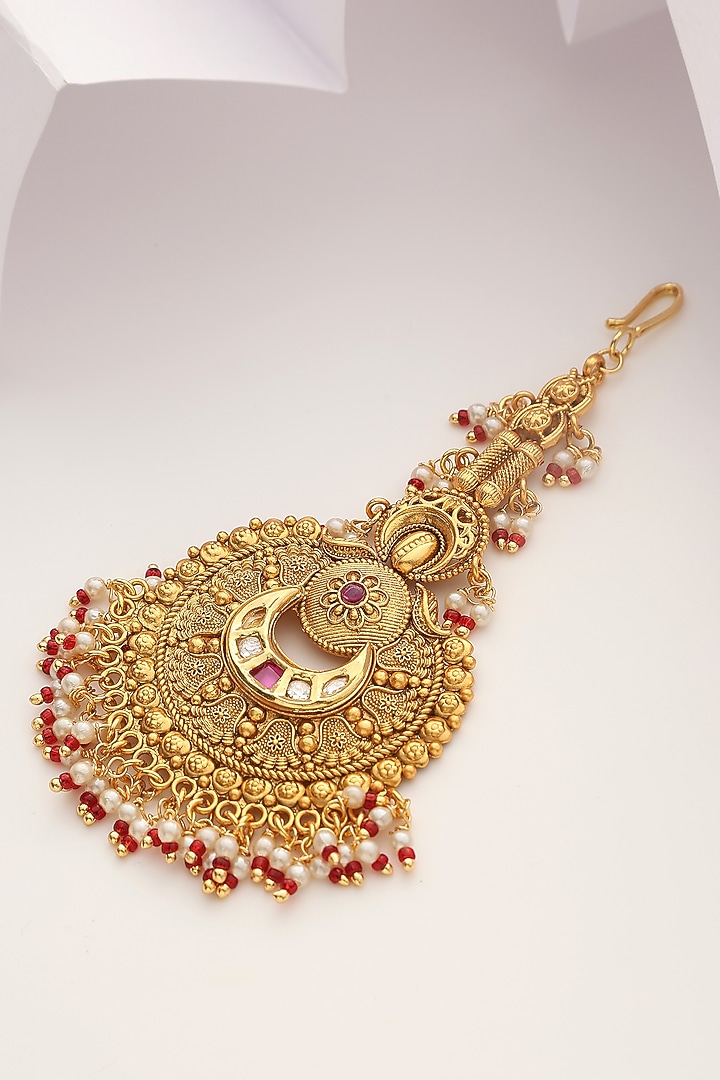 Gold Finish Red Stone Temple Maangtikka by MUDRA LUXE at Pernia's Pop Up Shop