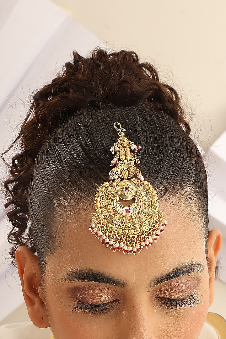 Gold Finish Red Stone Temple Maangtikka by MUDRA LUXE at Pernia's Pop Up Shop