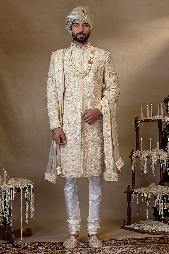 Cream Silk Embroidered Sherwani Set by NAMAN AHUJA