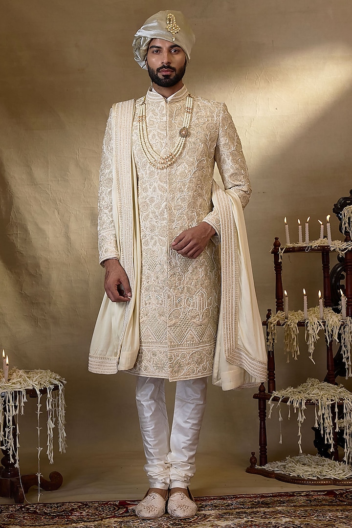 Cream Silk Embroidered Sherwani Set by NAMAN AHUJA