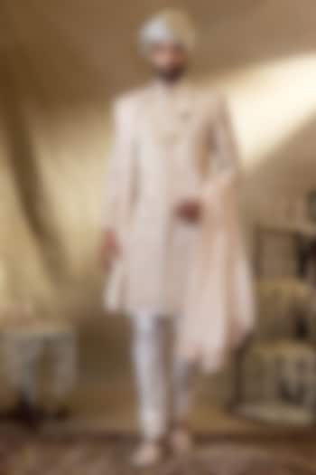 Cream Silk Embroidered Groom Sherwani Set by NAMAN AHUJA at Pernia's Pop Up Shop