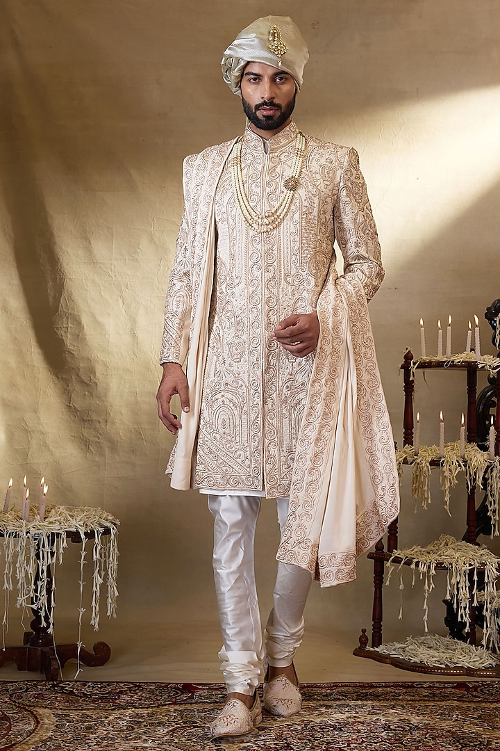 Cream Silk Embroidered Groom Sherwani Set by NAMAN AHUJA at Pernia's Pop Up Shop