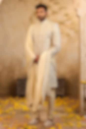 Ivory Gold Raw Silk Embroidered Groom Sherwani Set by NAMAN AHUJA at Pernia's Pop Up Shop