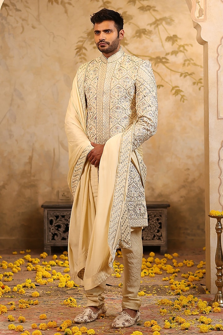 Ivory Gold Raw Silk Embroidered Groom Sherwani Set by NAMAN AHUJA at Pernia's Pop Up Shop