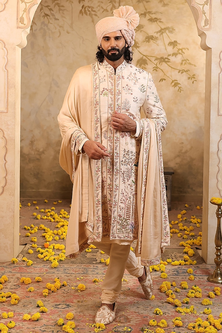 Soft Peach Raw Silk Embroidered Groom Sherwani Set by NAMAN AHUJA at Pernia's Pop Up Shop