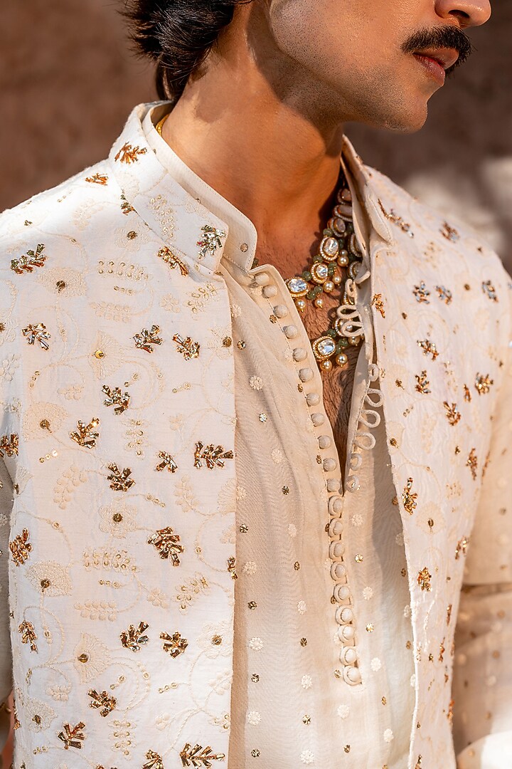 Ivory Chanderi Floral Embroidered Bundi Jacket Set by NAFS at Pernia's Pop Up Shop