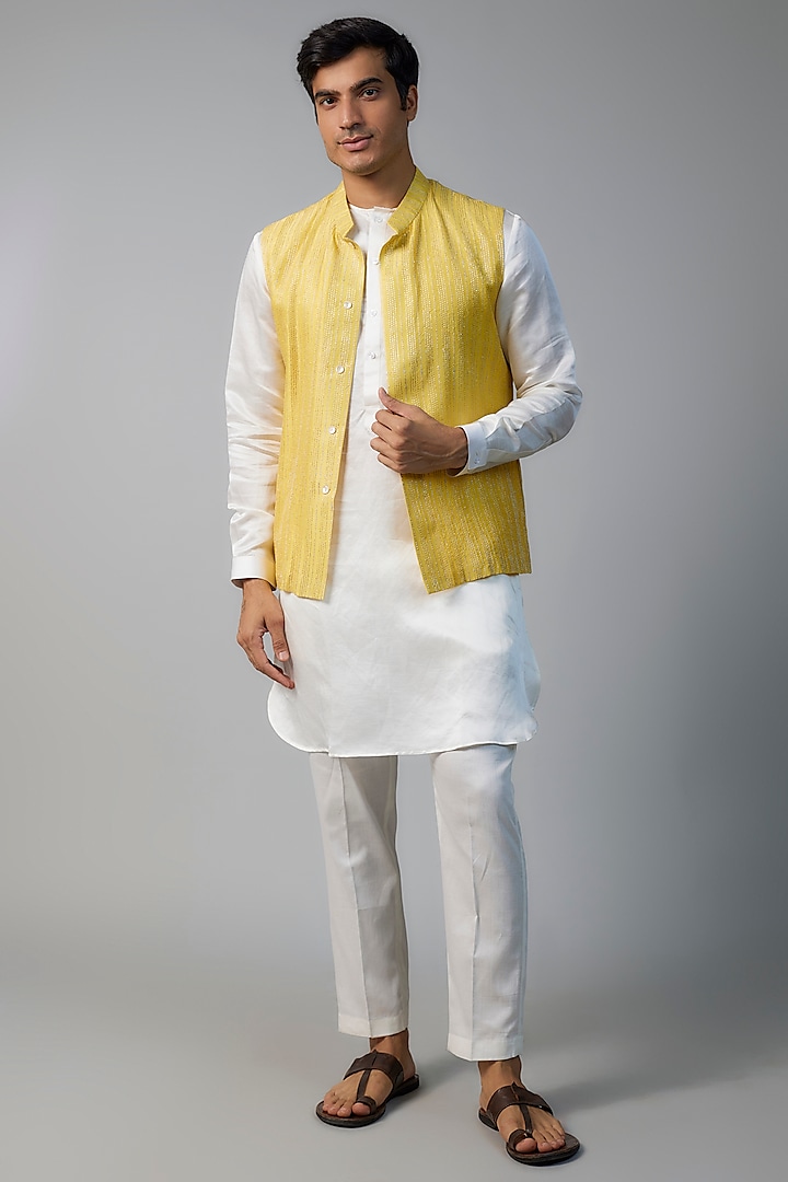 Yellow Linen Satin Zari Embroidered Bundi Jacket Set by NAFS