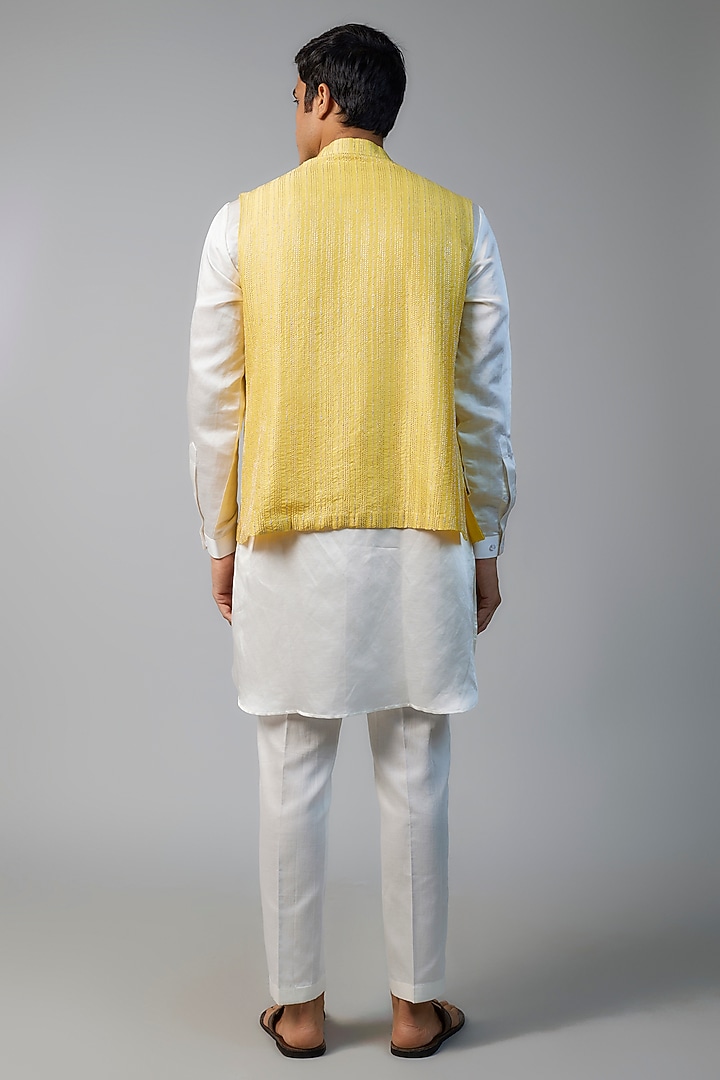 Yellow Linen Satin Zari Embroidered Bundi Jacket Set by NAFS at Pernia's Pop Up Shop