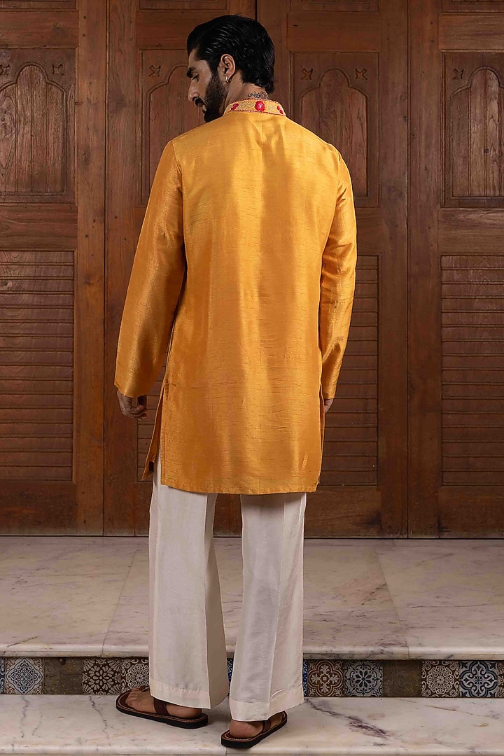Yellow Tussar Silk Floral Thread Embroidered Kurta Set by NAFS at Pernia's Pop Up Shop
