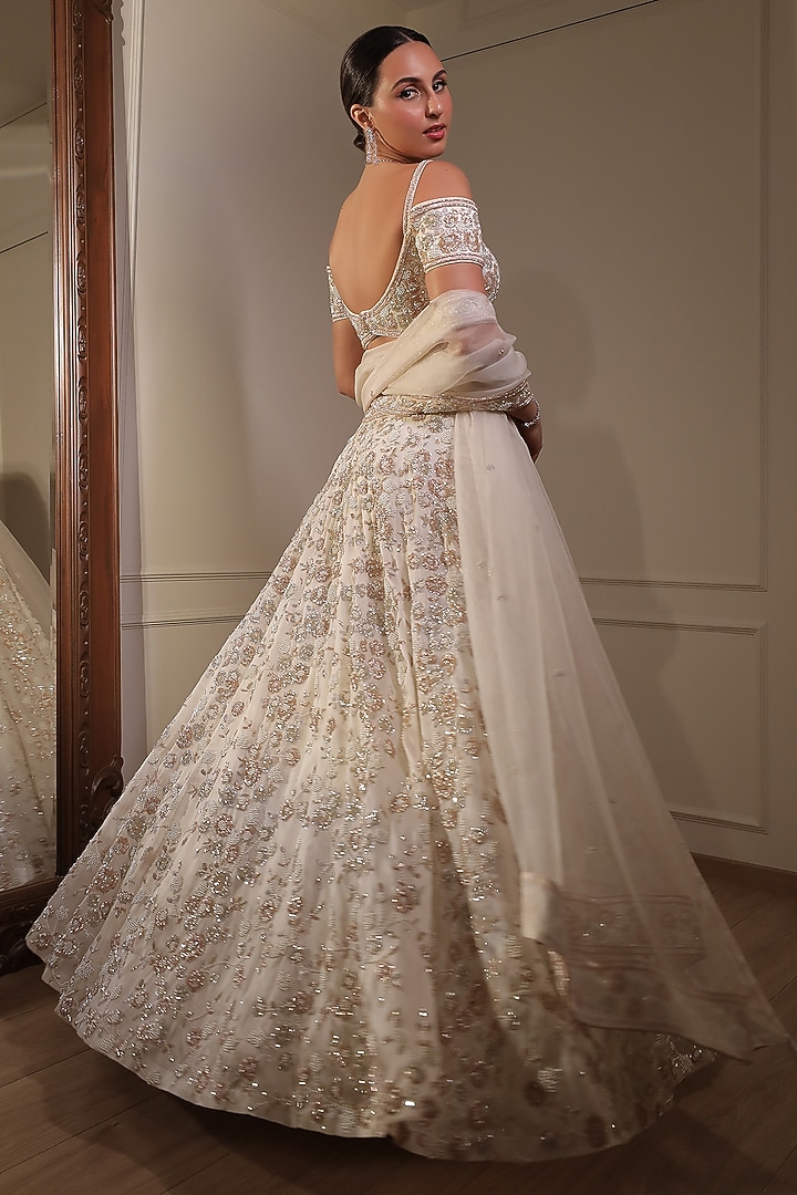 Ivory Organza Sequins Embroidered Bridal Lehenga Set by Naibah at Pernia's Pop Up Shop