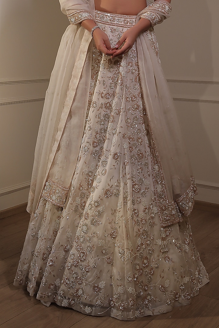 Ivory Organza Sequins Embroidered Bridal Lehenga Set by Naibah at Pernia's Pop Up Shop