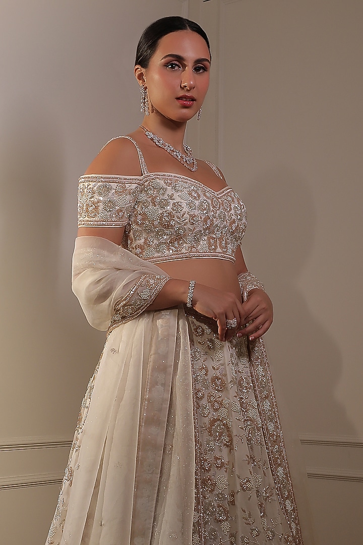 Ivory Organza Sequins Embroidered Bridal Lehenga Set by Naibah at Pernia's Pop Up Shop
