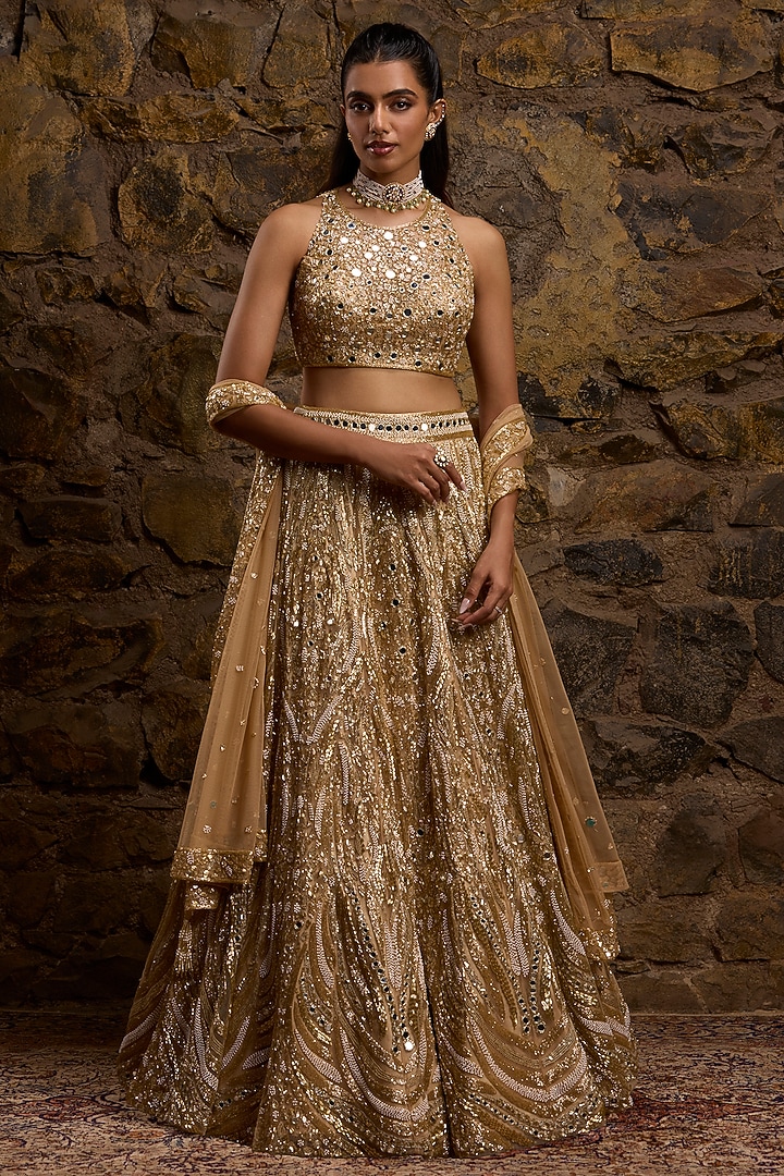 Gold Net Hand Embroidered Bridal Lehenga Set by Naibah at Pernia's Pop Up Shop