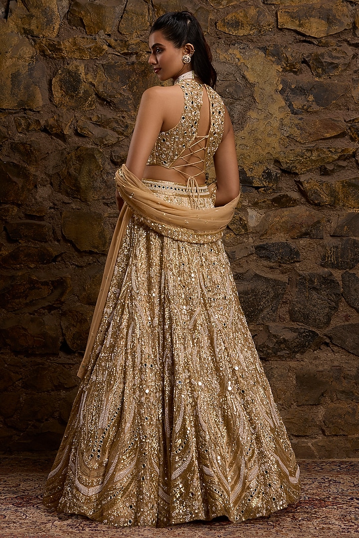 Gold Net Hand Embroidered Bridal Lehenga Set by Naibah at Pernia's Pop Up Shop