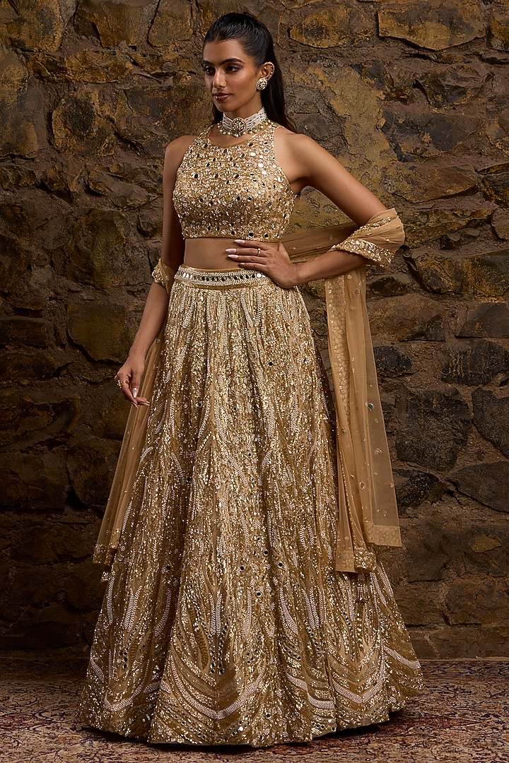 Gold Net Hand Embroidered Bridal Lehenga Set by Naibah at Pernia's Pop Up Shop