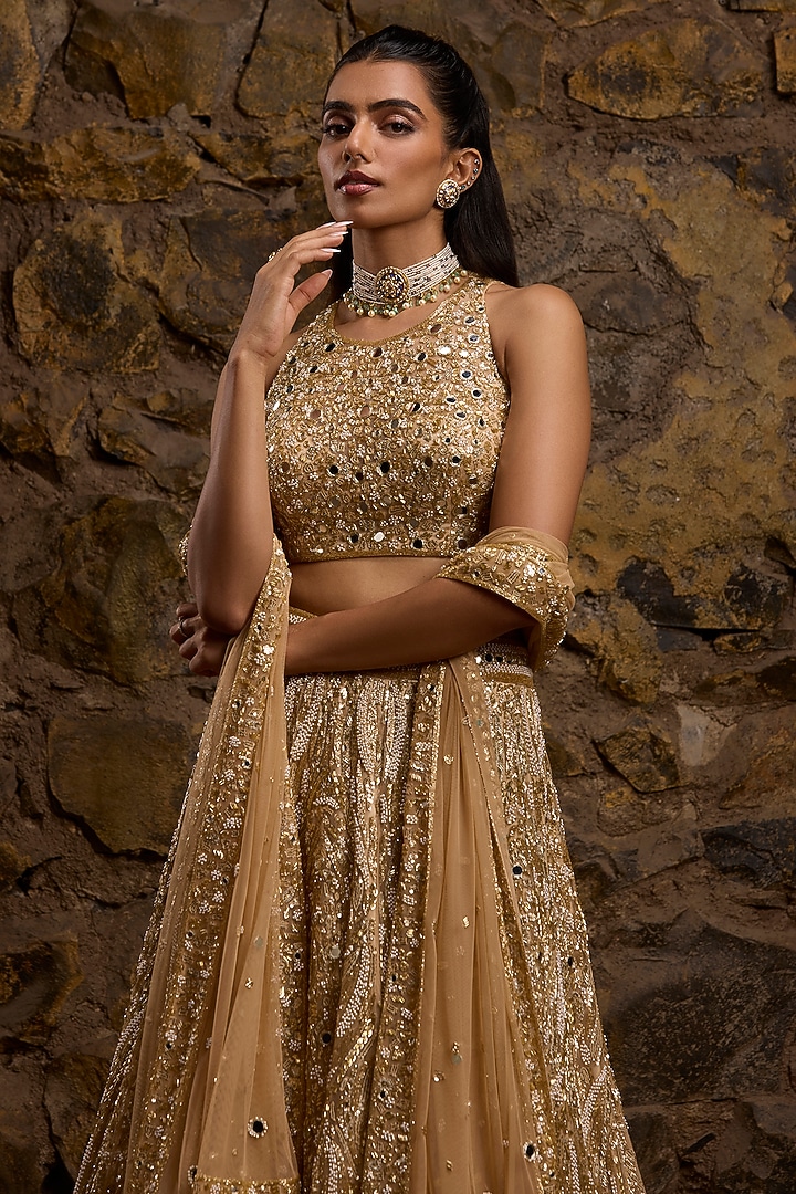 Gold Net Hand Embroidered Bridal Lehenga Set by Naibah at Pernia's Pop Up Shop