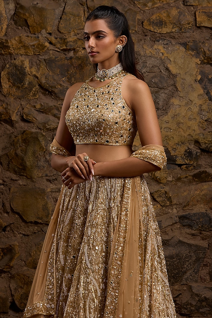 Gold Net Hand Embroidered Bridal Lehenga Set by Naibah at Pernia's Pop Up Shop