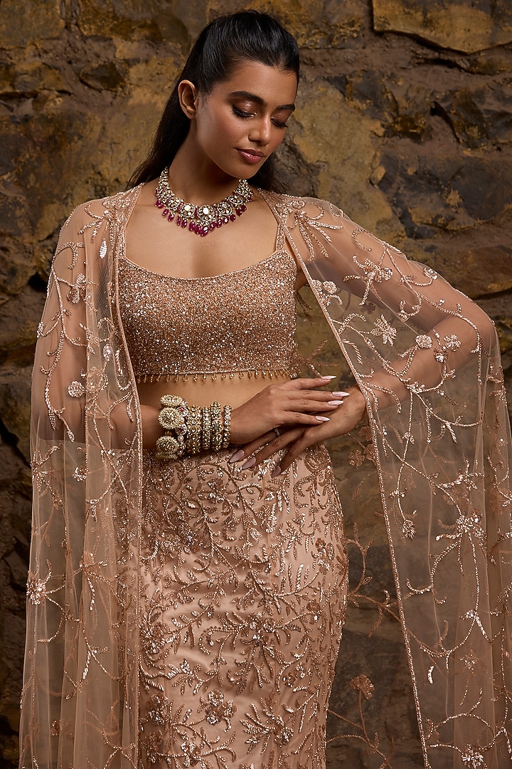 Rose Gold Net Hand Embroidered Fish-Cut Bridal Lehenga Set by Naibah at Pernia's Pop Up Shop