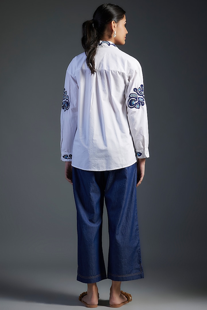 White Cotton & Denim Floral Motifs Hand Embroidered High-Low Shirt by Nakateki at Pernia's Pop Up Shop