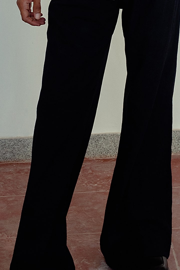 Black Wide-Legged Trousers by Naushad Ali Men at Pernia's Pop Up Shop
